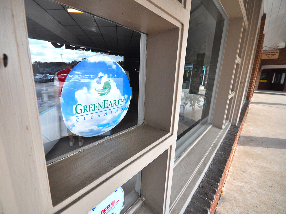 Green Earth Cleaners window with logo