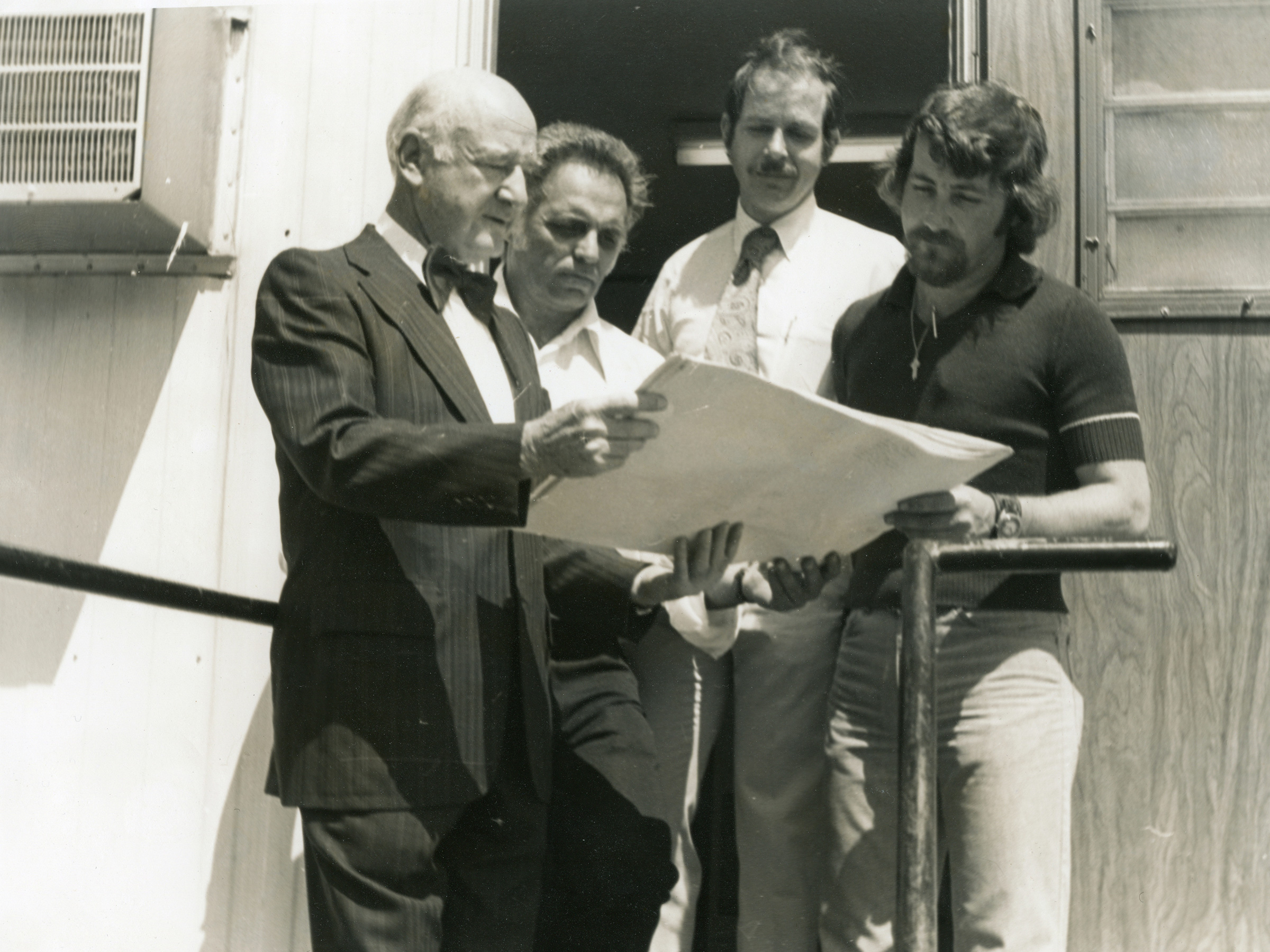 Members of Kaiserman Company looking over blueprints